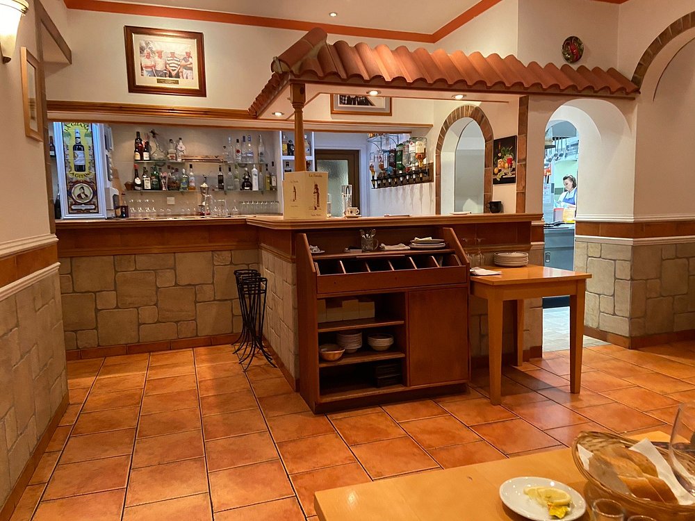 The bar area inside La Farola with terracotta tiled floor